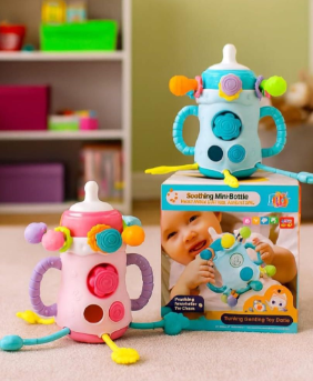 Juguete bebés asomas dientes tetero